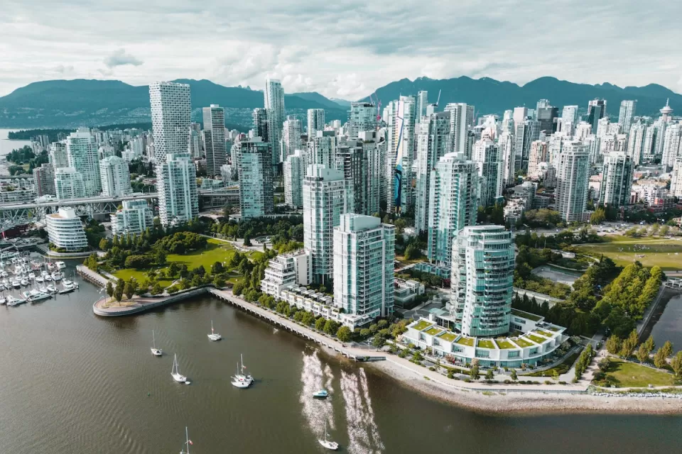 Aerial view of glass high-rise buildings on waterfront in Vancouver, British Columbia.